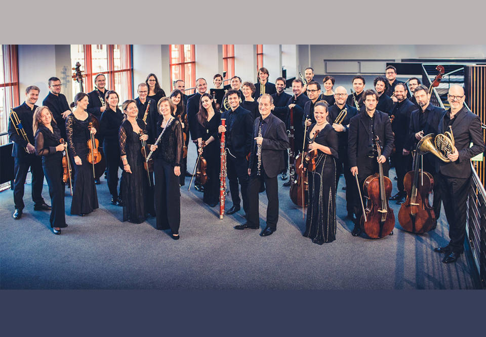Group photo of a orchestra.