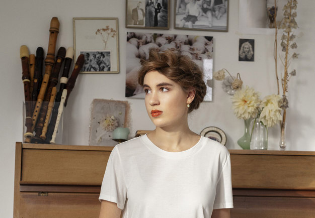 Woman in a white t-shirt. Photo. 