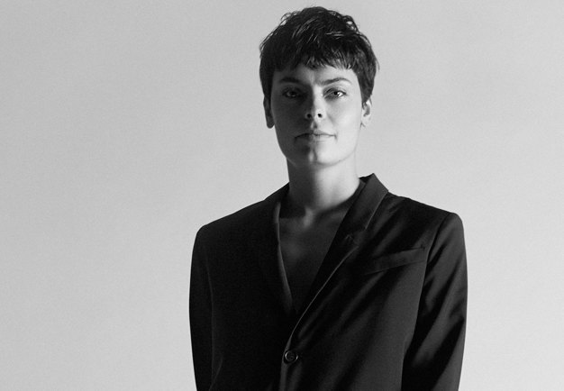 Black and withe portrait of a woman with short dark hair.