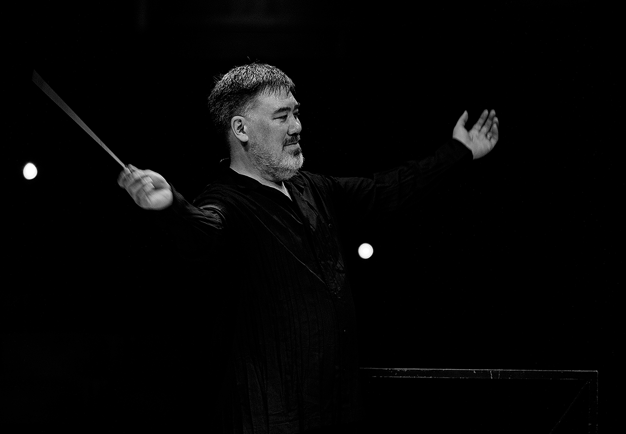 Conductor on stage. Photo.