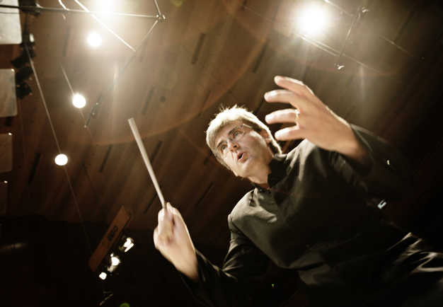 Intense moment of Thomas Dausgaard conducting, close-up from below. Photography.