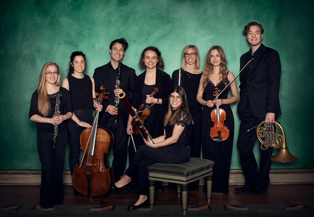 Group picture of the students. Smiles and holding their instruments.