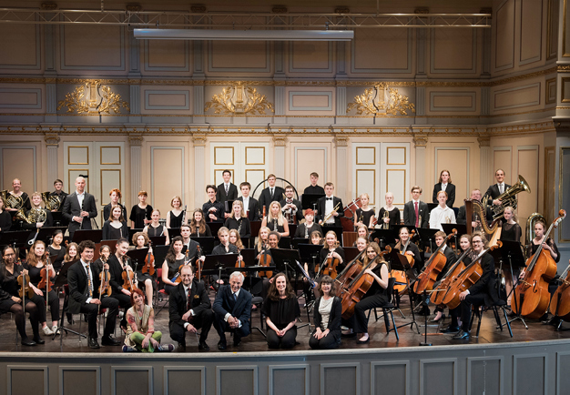 Large orchestra with young people. Photo.