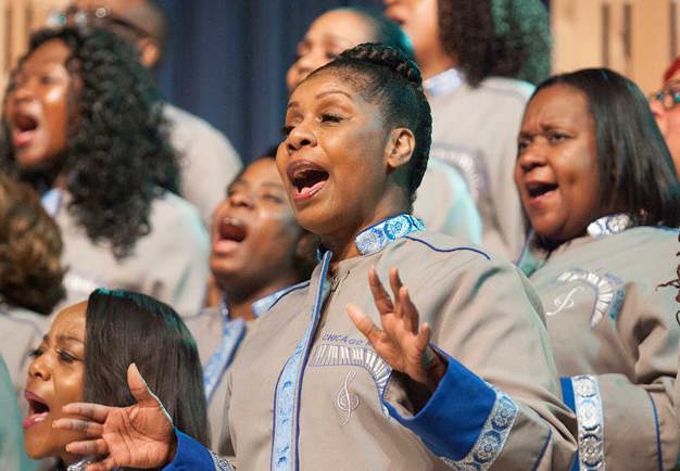 photo of a singing woman from the choir.