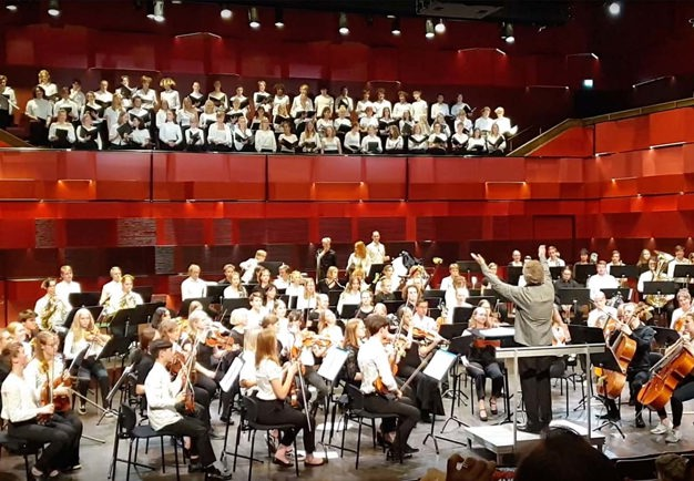 Orchestra with young people. Photo.