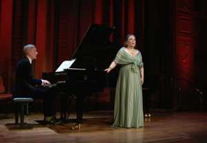 Woman singing and man playing piano. From the movie.