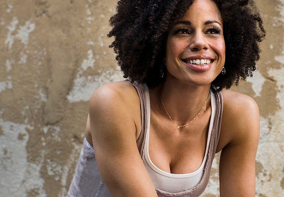 Woman who smiles into the camera. Photo.