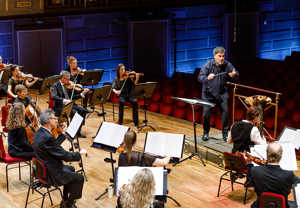 Conductor and orchestra during livestream