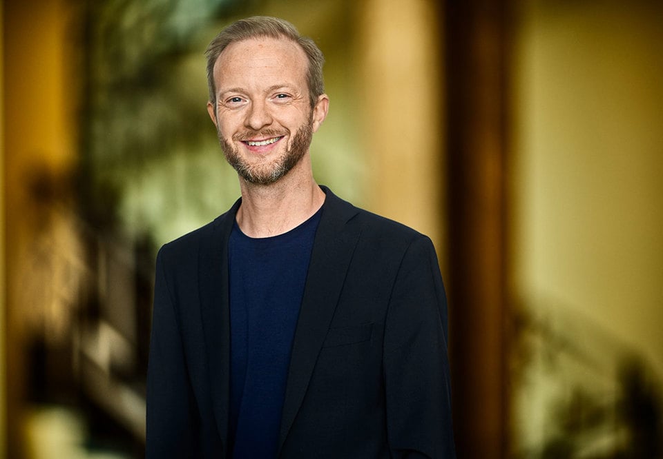 Photo of a smiling man.