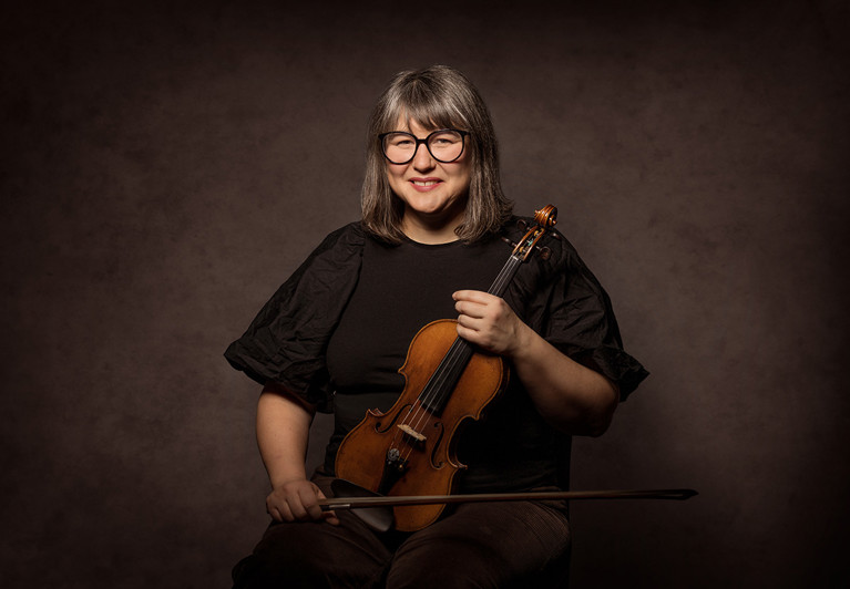 Close-up. Emma looks happy and is smiling. Photography.