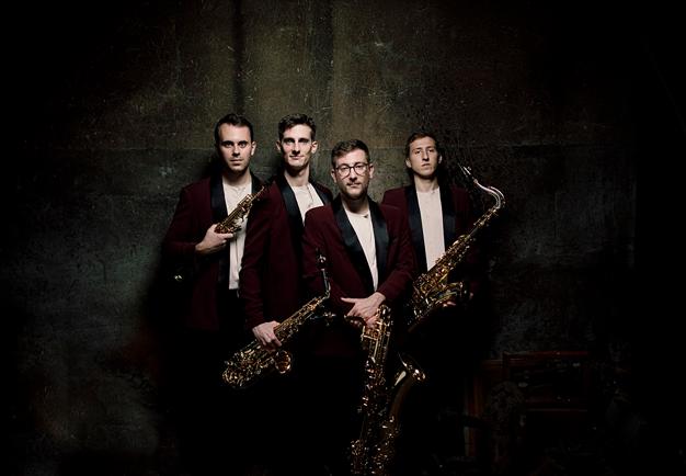 Four men with saxofones.