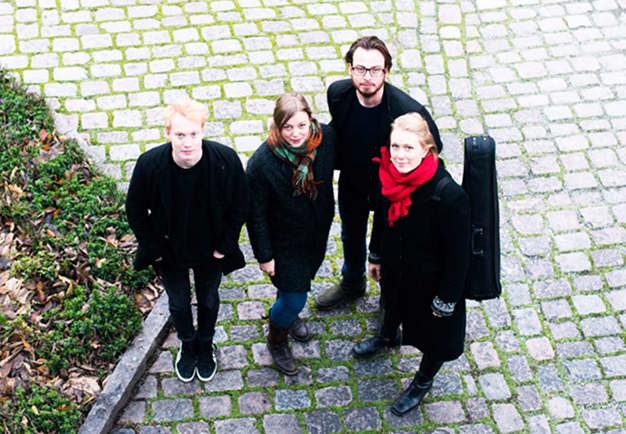 Quartet going down on stairs outside. Photo.