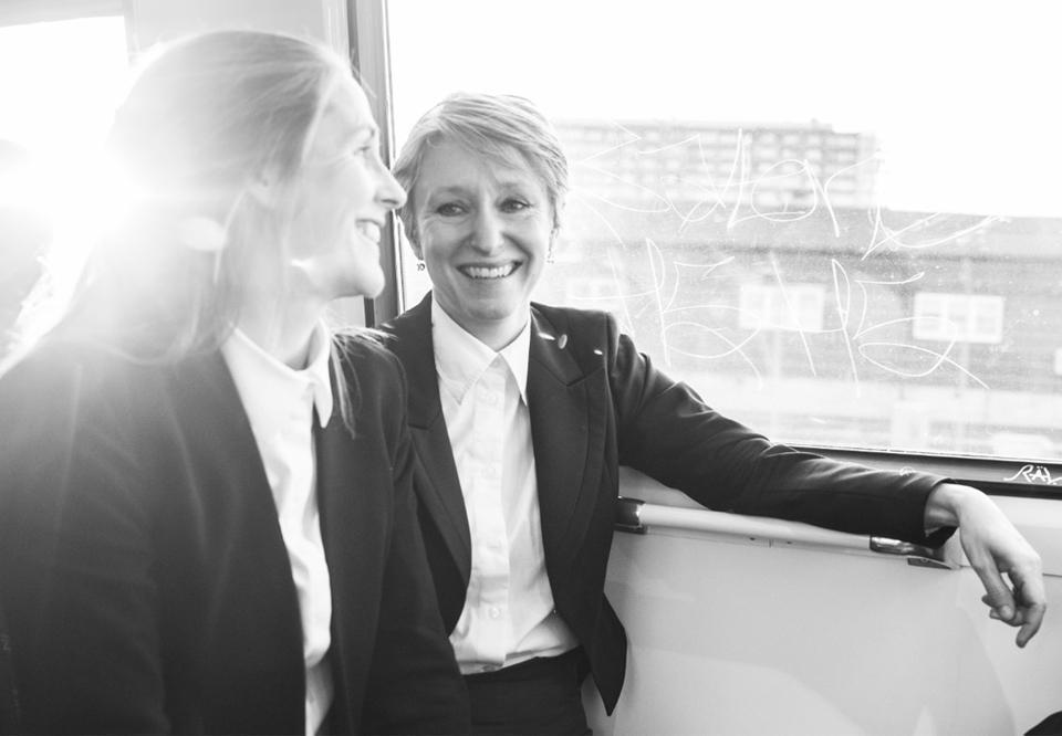 Two women on a train. Photo.