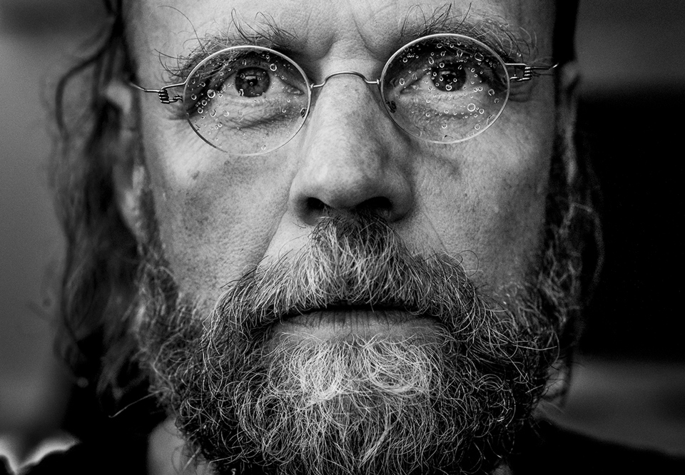 Close up on a man with glasses, black and white