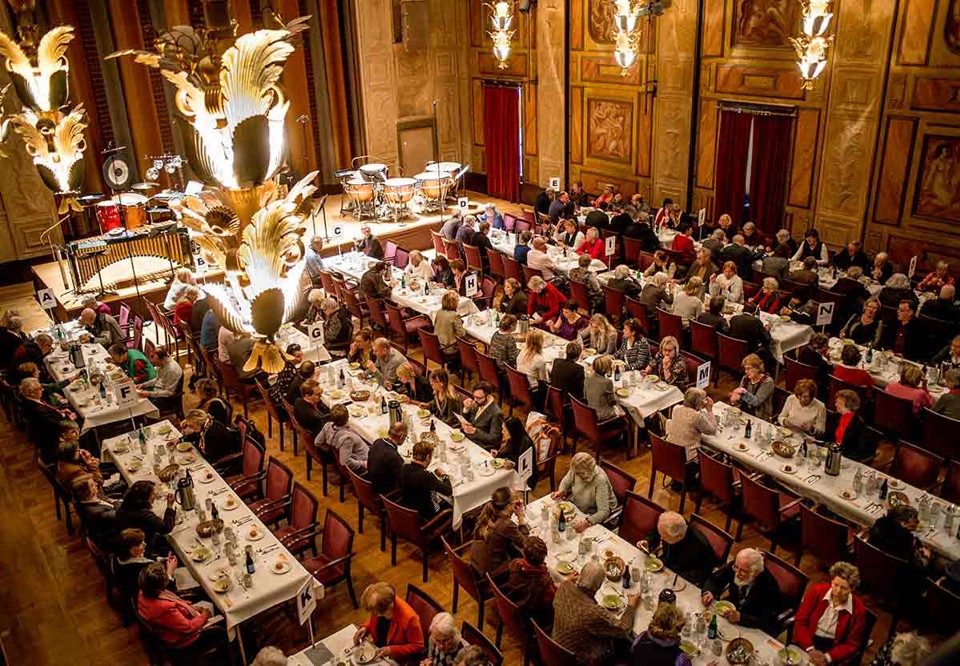 Photo of people eating at a lunch concert.
