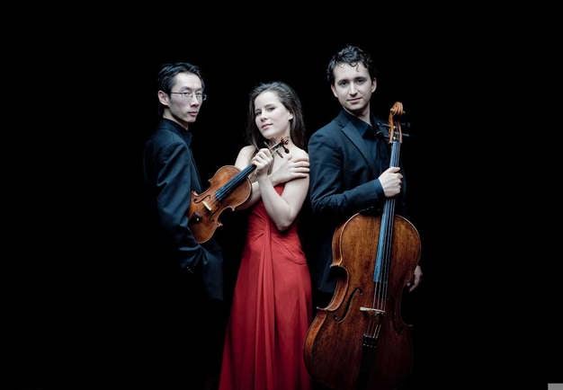 Three young musicians. Photo.