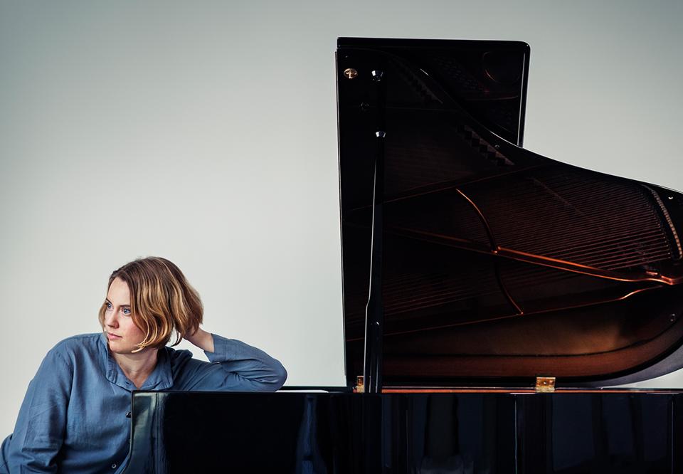 Woman playing piano. Photo.