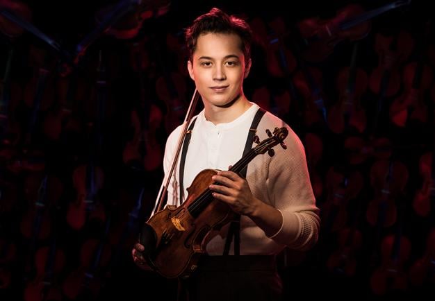 Young man with a violin. Photo.