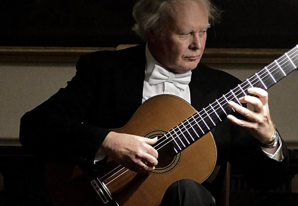 Man playing classical guitar. Photo.
