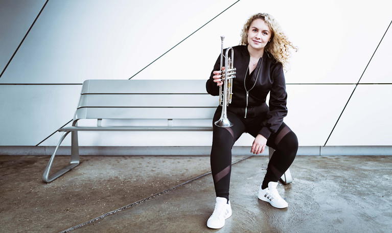 Woman with a trumpet. Photo.