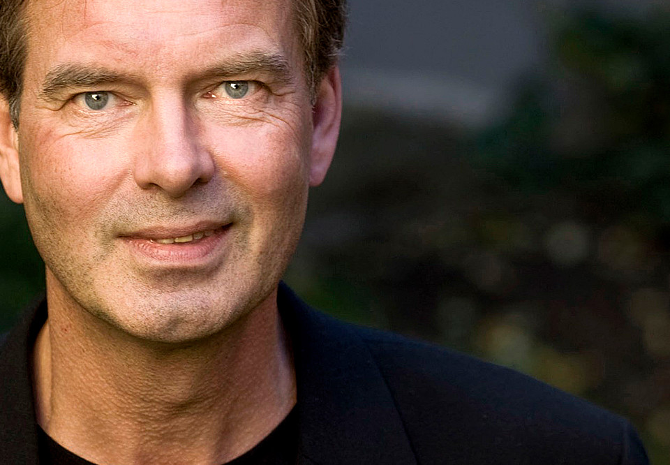 Close up on a smiling man. Photo.