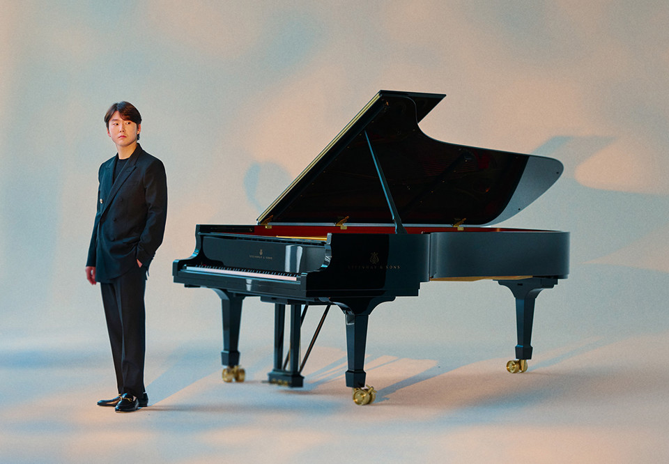 Young man with piano. Photo